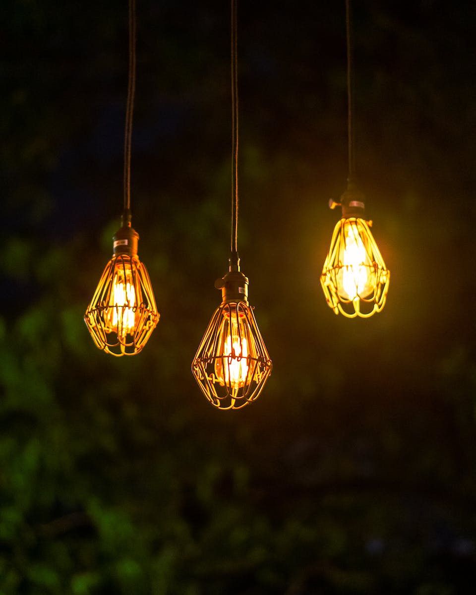 Close-up of Three Lamps Hanging Outdoors